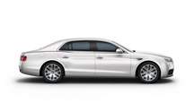 Side view of an ice white Bentley Flying Spur with silver wheel rims | Bentley Motors