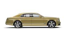 Side view of a gold Bentley Mulsanne Speed with silver wheel rims | Bentley Motors